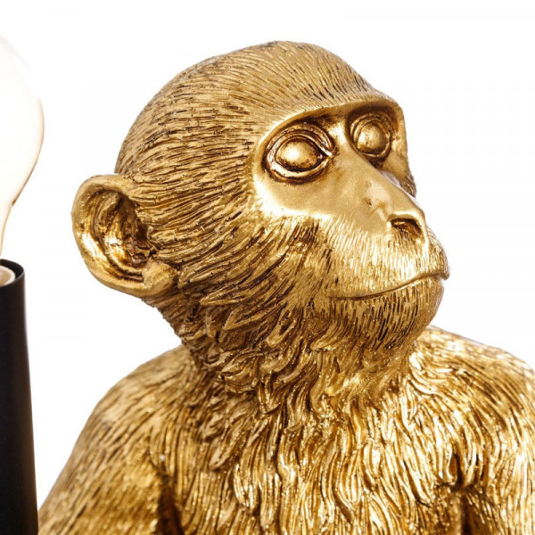 Lámpara de mesa mono dorado